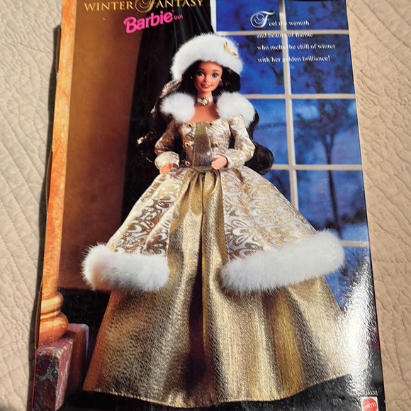 Barbie is a brunette in a gold winter gown trimmed in white fur. - Picture 4 of 4